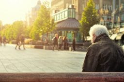 Elderly Man Sitting Alone on a Bench