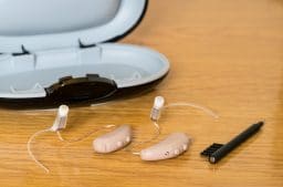 Hearing aids and a cleaning brush.